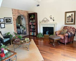 Leather recliner, footstool, rug, books, art, decorative items, collectibles