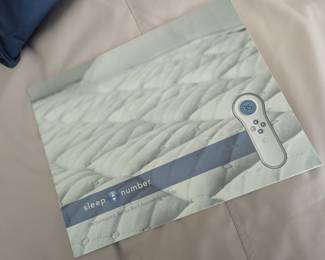 Queen Sleep Number Bed with protective mattress covers. 