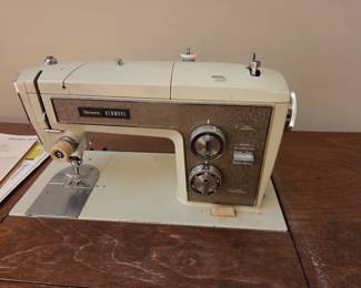 #81	Sears Kenmore Vintage Metal Sewing Machine and Cabinet	 $60.00 
