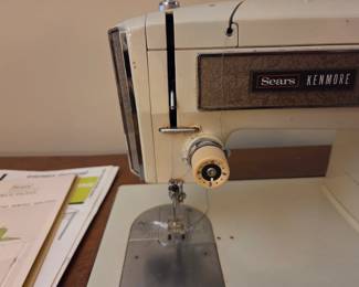 #81	Sears Kenmore Vintage Metal Sewing Machine and Cabinet	 $60.00 
