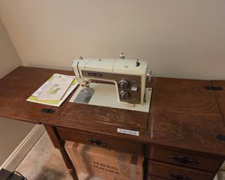 #81	Sears Kenmore Vintage Metal Sewing Machine and Cabinet	 $60.00 
