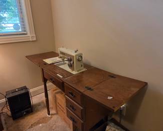#81	Sears Kenmore Vintage Metal Sewing Machine and Cabinet	 $60.00 
