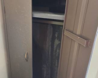 #92	Brown Metal cabinet w/2 doors w/2 1 shelf & 1 Bar  24x20x64	 $75.00 
