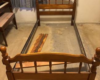 Single bed with side rails and slats