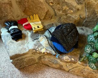 Gloves, hats, hats on end of fireplace in living room