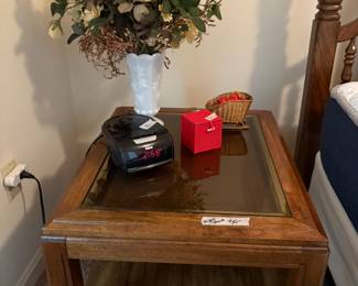 Night stand with tempered glass insert, flowers in vase, clock radio & miscellaneous in bedroom