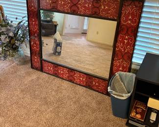 Red metal surround large mirror
