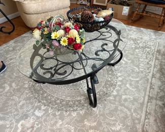 . . . glass and wrought-iron table with beautiful area rug