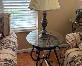 . . . wrought-iron and glass end table with accent lamp
