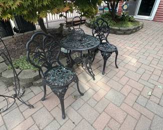 . . . black wrought-iron bistro set