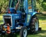 The Ford tractor in the front yard (runs)