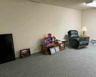 Flat screen TV, toys, coffee table, recliner