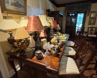 Lamps and Household Decorative Pieces.    Chippendale table with two captain chairs and 6 side chairs with two 18 inch Leaf Extensions.