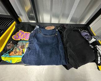 $10 - Lot of Assorted Clothing - size Medium Scooby-Doo T-Shirt, Size 36/32 Men's Blue Jeans, Size 34/32 Men's Black Jeans, Three Pairs of Halloween-Themed Socks(Boney, Jack Skellington, Zombies)