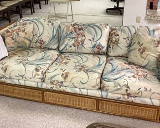 Rattan Couch with floral cushions