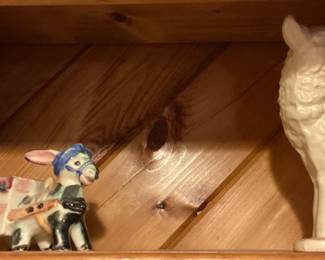 Donkey pulling a cart and a wolf figurines