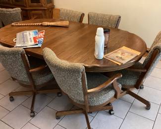 Oak Dining Table with 6 chairs on wheels