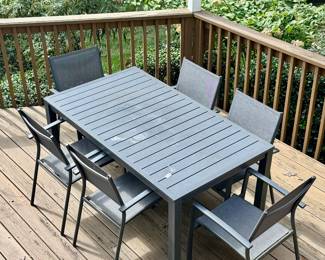 Super cool (literally - this one is the kind that does not get super hot in the heat) table with 6 chairs
