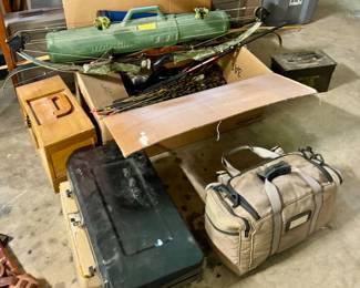 Hunting supplies - bows, gun cases, pellet gun, ammo...Orvis waiters, fly fishing gear, fishing rods, animal traps...this basement is a hunters heaven