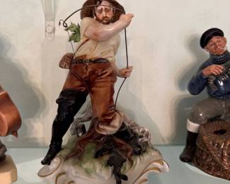 Porcelain Figurine of a Hunter with Dog 