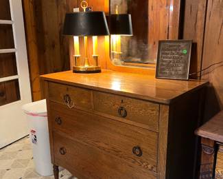 Antique Oak Dresser with Mirror – Elegant oak dresser featuring a carved framed mirror, four spacious drawers, and classic round pull hardware. Stands on turned legs with casters for easy movement. A timeless piece of early 20th-century craftsmanship, perfect for a bedroom or entryway.
Vintage Brass & Black Table Lamp – Unique mid-century style lamp with a brass base, three slender column lights, and a black shade. Adds a bold, stylish accent to any room.
Inspirational Wall Plaque – “God grant me the serenity…” decorative plaque, perfect for inspirational home décor.
✨ Stunning antique oak furniture with original mirror.
✨ Great for farmhouse, vintage, or traditional décor lovers.
✨ One-of-a-kind estate find – must see!