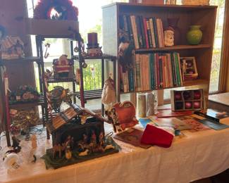 Christmas & Holiday Décor Collection – Wide assortment of festive decorations, including a large nativity set with stable and figurines, Santa figurines, holiday wreaths, and ornaments. Perfect for adding charm to your seasonal displays.
Books & Bookcase – Small wooden bookcase filled with a mix of hardcover and paperback books, including literature, reference, and decorative editions.
Assorted Holiday Items – Vintage Santa hat, boxed Christmas ornaments, seasonal table décor, and other festive accents.
Miscellaneous Collectibles – Includes vases, framed art, and small decorative household items displayed throughout the shelving.
✨ Great variety of holiday decorations and collectibles.
✨ Perfect for Christmas lovers, crafters, or seasonal decorators.
✨ Affordable treasures – must-see holiday section!