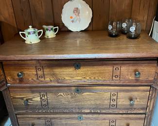 Beautiful antique 4-drawer wooden dresser with rich grain detail and original hardware. Features decorative keyhole accents and a sturdy, classic design perfect for restoration or use as-is. A true vintage piece that adds warmth and charm to any room.
Also pictured on top:
Hand-painted porcelain plate featuring a Victorian lady motif
Delicate sugar and creamer set with floral design
Set of four vintage glasses
This dresser is a standout item for collectors of antique furniture or anyone seeking timeless, functional storage with character.