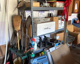 Shelving unit, paper products, garden tools, jack stands, oxygen machine
