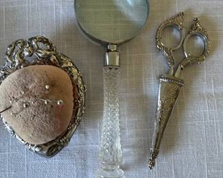 Sterling pin cushion, magnifying glass, boutiques scissors 