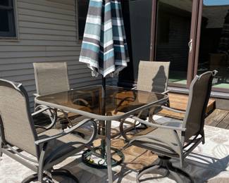 Very nice outdoor patio table and chairs, rug, umbrella