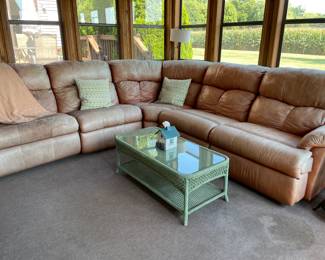 Leather couch, wicker coffee table