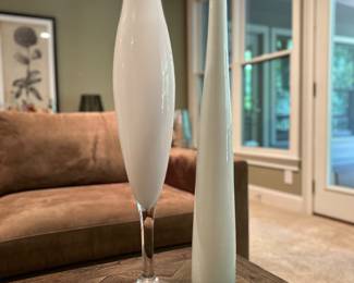 Z Gallerie Tall White Glass Vases (Pair)
$45
Set of two modern decorative glass vases from Z Gallerie. One features a flared top with clear base stem, the other a tall slender cylinder. Both finished in glossy white, perfect for a chic, modern statement.
Heights: approx. 24″ and 18″. Excellent condition.