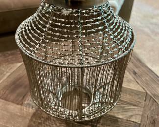 Metal Wire Candle Holder/Lantern - $10
Modern silver-tone wire lantern with glass insert. Open lattice design casts beautiful light patterns when used with a candle. Can be used indoors or outdoors as a decorative accent.

Dimensions (approx.): 10” tall × 9” wide
Condition: Excellent
