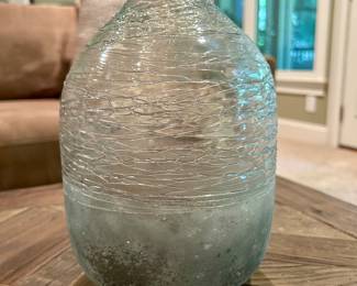 Handblown Glass Vase with Textured Design - $12
Unique decorative glass vase with a rounded form, clear body, and frosted lower half. The upper section features an intricate wrapped glass texture that catches light beautifully. Perfect as a standalone statement piece or for displaying flowers and greenery.

Dimensions (approx.): 10” tall × 6” wide
Condition: Excellent, no chips or cracks.