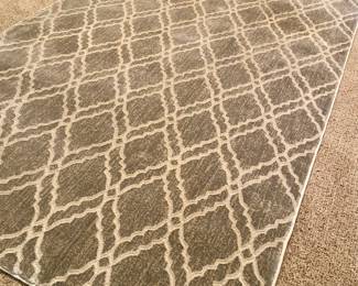 Custom Rug – 9 ft x 4.5 ft - Price Firm $250
Stylish area rug in a soft gray with cream lattice pattern.
•	Dimensions: 9 ft x 4.5 ft
•	Neutral tones work with many décor styles
•	Quality bound edges and soft pile for comfort and durability
•	Condition: Excellent, gently used, smoke-free home
Perfect size for an entryway, home office, or under a small dining table.