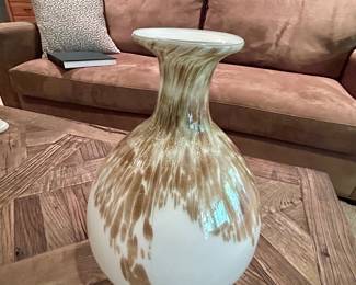 Large Brown & White Glass Vase - $18
Tall decorative glass vase with wide round base and flared neck. Features a feathered drip glaze effect in warm brown over white, creating a natural, earthy look. Makes a bold statement on its own or as a floor vase.

Approx. 16–18″ tall. Excellent condition.