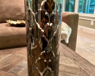 Debi Lilly Kaleidoscope Vase $10
Tall cylindrical glass vase with a mirrored silver overlay in a Moroccan lattice pattern. Designed by Debi Lilly, this striking piece reflects light beautifully and makes a bold decorative accent.