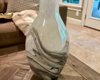 Swirled Glass Vase - $15
Elegant glass vase with a flared rim and modern black-and-white swirl design. Striking as a centerpiece or for displaying fresh or faux flowers.

Dimensions (approx.): 12” tall × 6” wide
Condition: Excellent