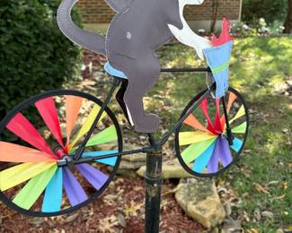 This is wind-driven cat on a bike. He is too cute!
