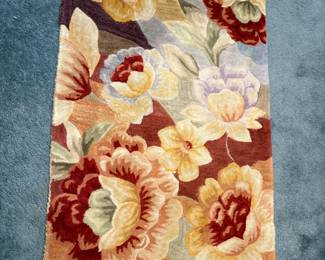 One of several thick floral wool rugs.