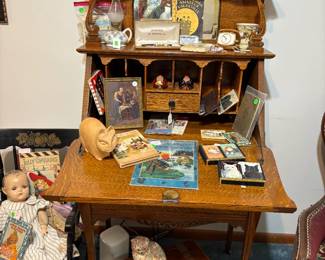 Antique secretary loaded with antiques and goodies.
