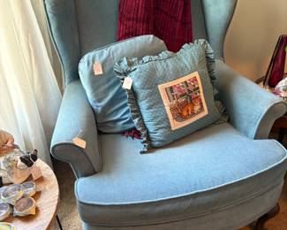One of the blue wing-back chairs in the second bedroom.