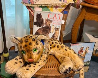 Child's antique rocker and vintage Steiff leopard.