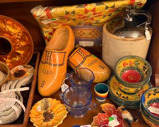 Colorful dishes and an old jug.