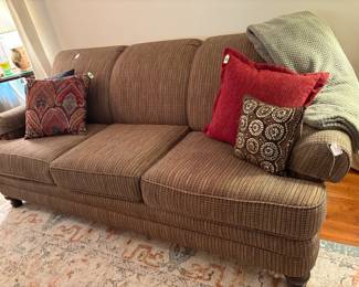 This is a new 3 cushion divan that was purchased for a senior apt. that was vacated after only 2 weeks. It is much more handsome when seen in person. This picture doesn't really represent the true color. Anyway, it is very comfortable and would blend with any room.