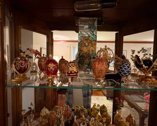 A view of the Joan Rivers egg collection. They are very fragile. If you wish to see them, we have someone who will assist you. Each egg has its own unique stand.