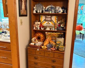 Country cabinet full of kitchen collectibles and Dutch themed items.
