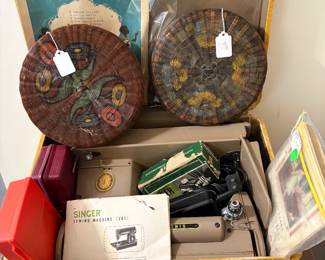 Vintage Singer sewing machine and old sewing baskets. The machine works like a champ.