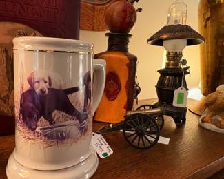 Hunting theme stein and miniature cannon.