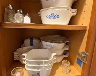 A collection of Corning Ware in the Cornflower pattern.